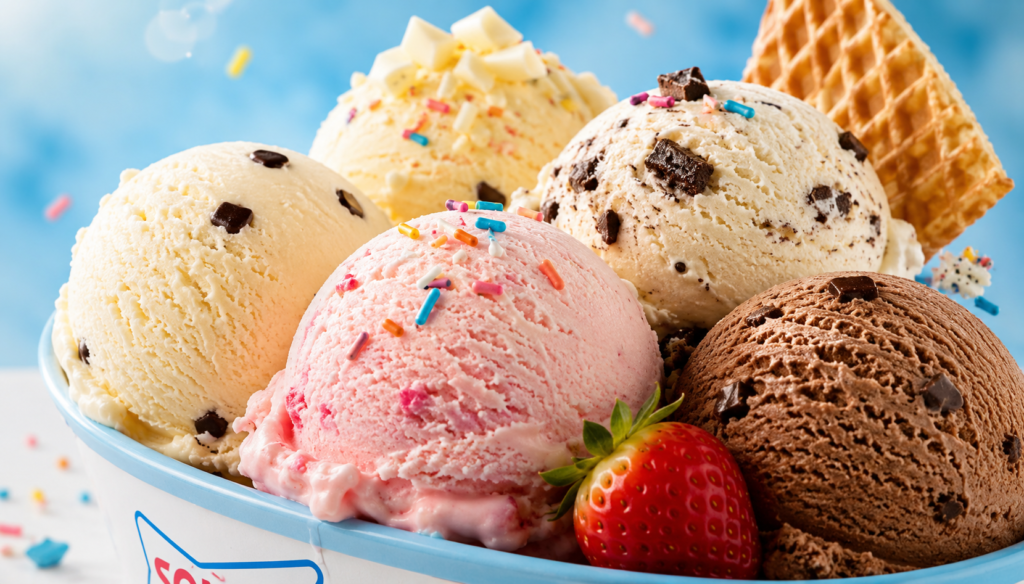 Ice Cream assorted scoops of vanilla, strawberry, chocolate, cookies and cream, and birthday cake ice cream in a dessert bowl.